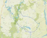 Trasa rowerowa wokół jezior i lasów, prowadząca przez malownicze miejscowości, w tym **Janikowo**.