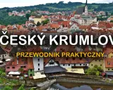 Widok na urokliwy Czeski Krumlov, jedno z najpiękniejszych miast Czech, z charakterystycznymi czerwonymi dachami i wieżą kościelną.