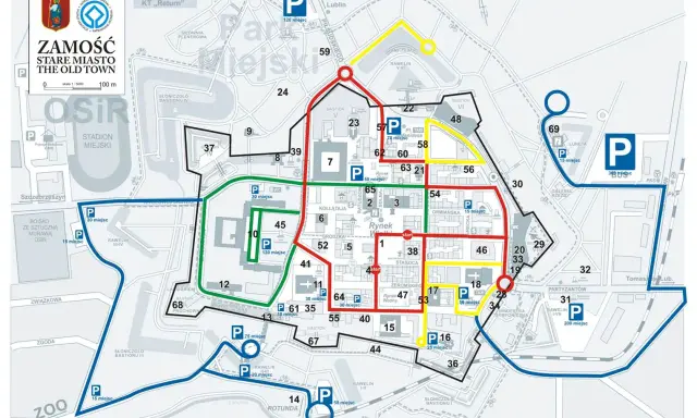 Mapa Zamościa z zaznaczonymi trasami spacerowymi i parkingami. Kolorowe linie wskazują różne ścieżki zwiedzania.