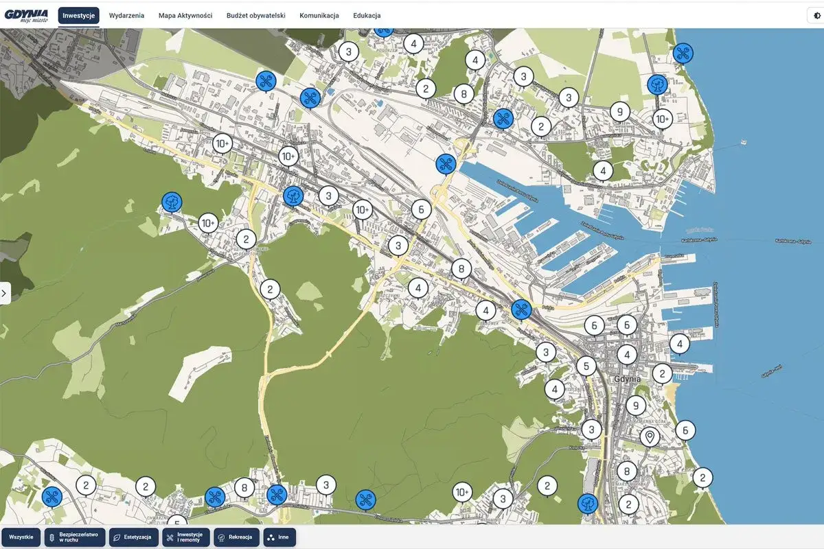 Mapa Gdyni z zaznaczonymi punktami inwestycji, zieleni i innych projektów. Widoczna trasa Gdynia i ikony symbolizujące różne kategorie.