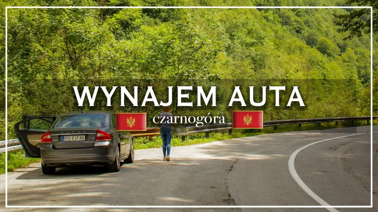Wynajem auta w Czarnogórze. Szara limuzyna z otwartymi drzwiami na krętej drodze wśród zielonych wzgórz.